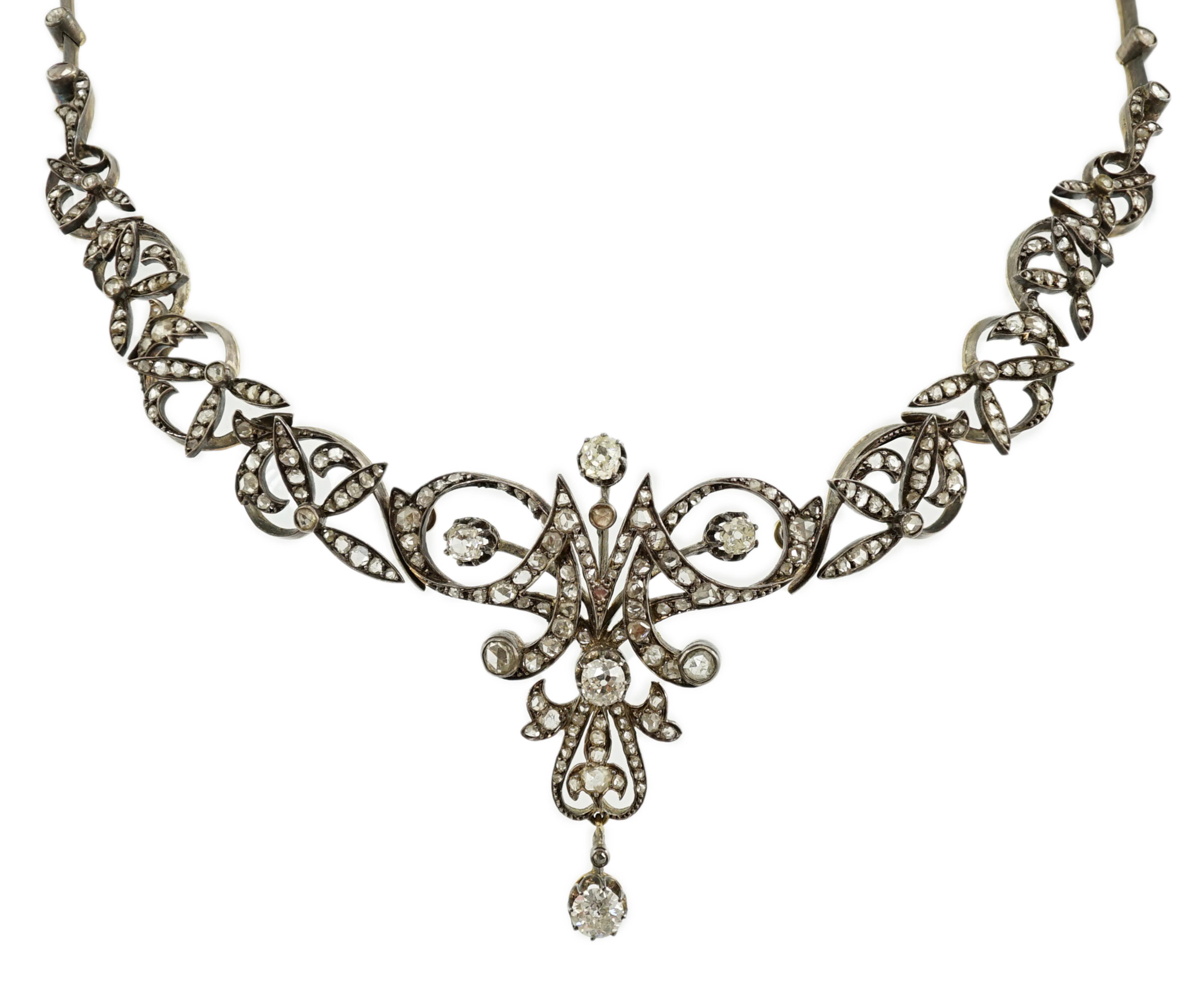 A late 19th/early 20th century French 18ct gold and silver, old mine and rose cut diamond cluster set tiara/necklace